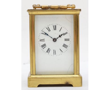 A mid 20th century carriage clock, brass cased with 8 day movement, Roman numerals to enameled face, 11.5 x 8 x 6.5 cm. 