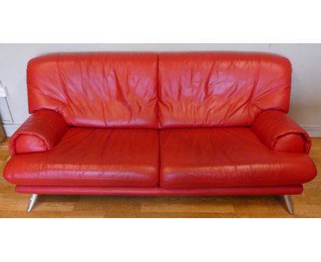 A modern red leather three seater sofa, L-186, H77 cm. 