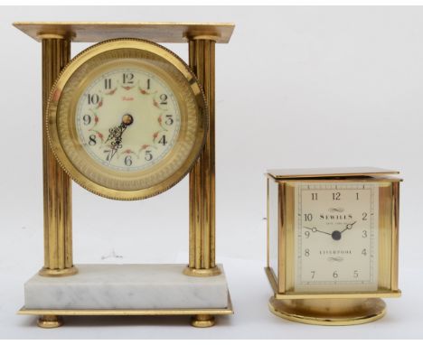 A brass cased rotating combination clock, 11 cm, together with another brass and marble based clock. 