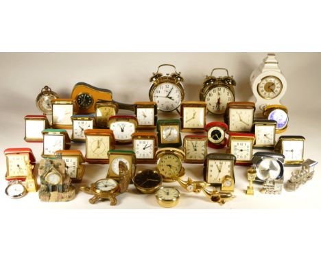 A collection of miniature novelty clocks, together with traveling alarm clocks, having manual and quartz movements. (3) 