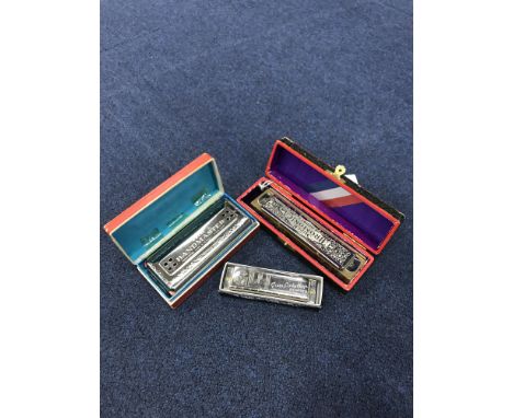 THE SUPER CHROMONICA CHROMATIC HARMONICA, along with a Hohner Great Little Harp and the Bandmaster de Luxe harmonica