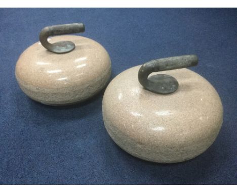A PAIR OF VINTAGE SALMON GRANITE CURLING STONES