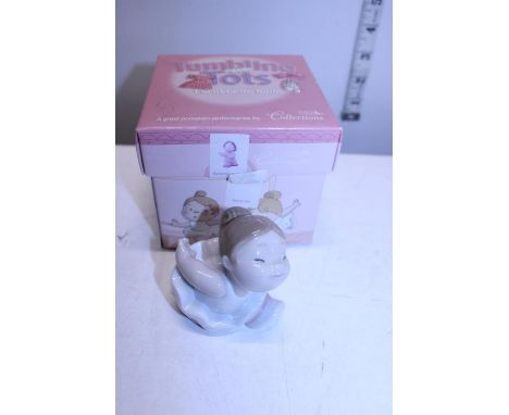 A boxed tumbling tots NAO figure 