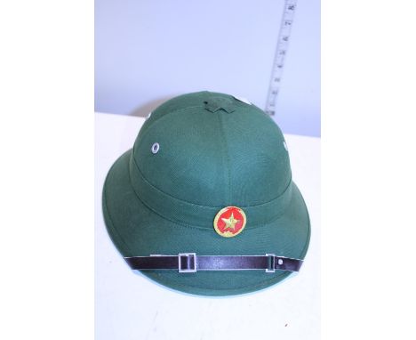 A vintage military style Pith helmet 