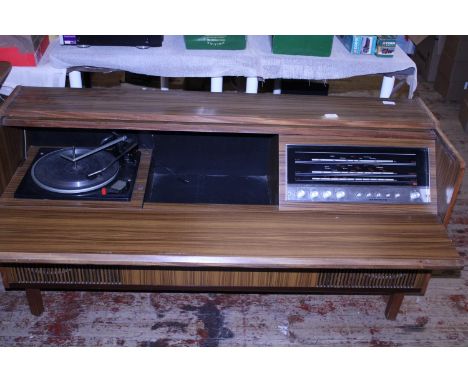 A vintage 1970's teak effect audio unit, 132cm X 41cm X 65cm postage unavailable 