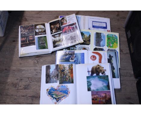 Five albums full of vintage postcards and other ephemera 