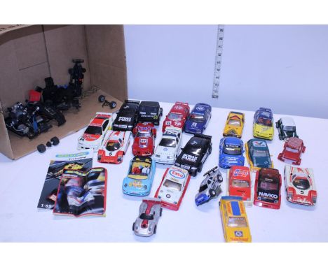 A box full of vintage slot cars 