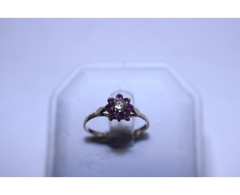 A hallmarked 9ct gold ruby and diamond solitaire ring 