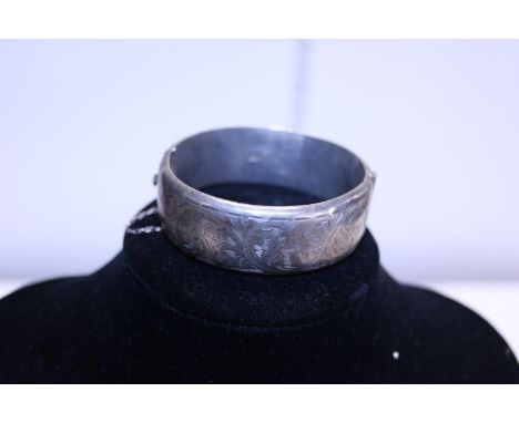 A hallmarked silver bangle 34g 
