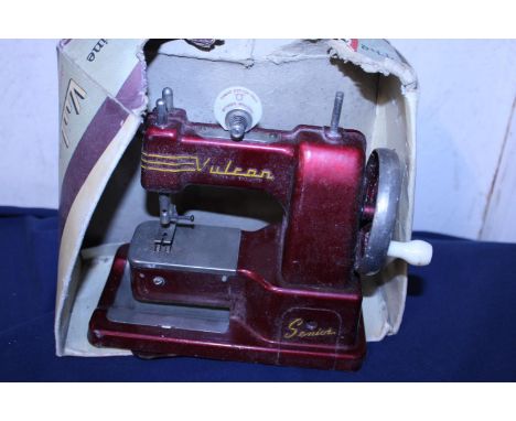 A child's vintage Vulcan sewing machines 