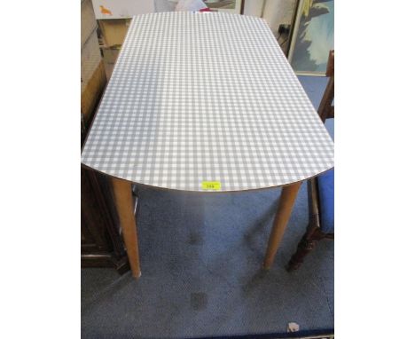 A vintage folding kitchen table with chequered Formica top above light wooden legsLocation: RAM 