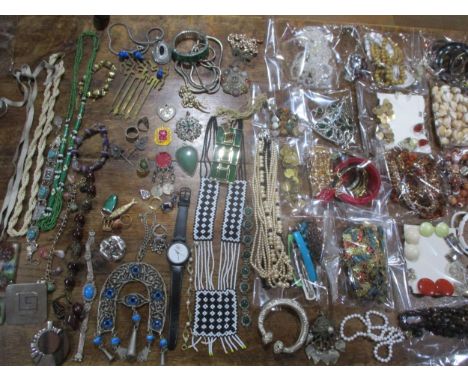 Costume jewellery to include a Guy Laroche chrome pendant, a silver coloured slave bangle, vintage Eastern items to include p