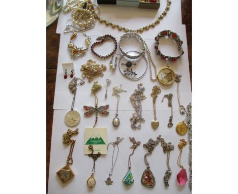 Mixed costume jewellery, mainly pendants on chains to include silver examples and a sterling silver jewellery set with red co