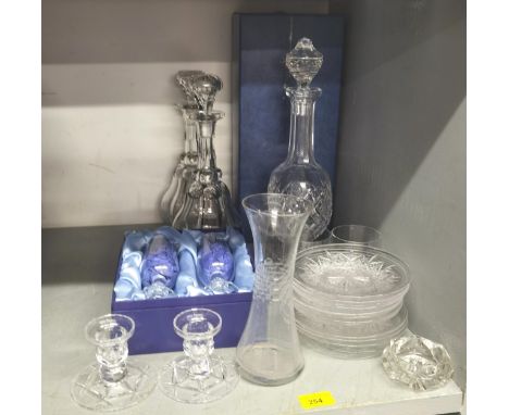 Glassware to include a Waterford decanter boxed, a pair of decanters, candlesticks and other items 
