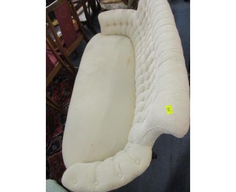 A Victorian button upholstered sofa on turned, tapered mahogany legsLocation: C 