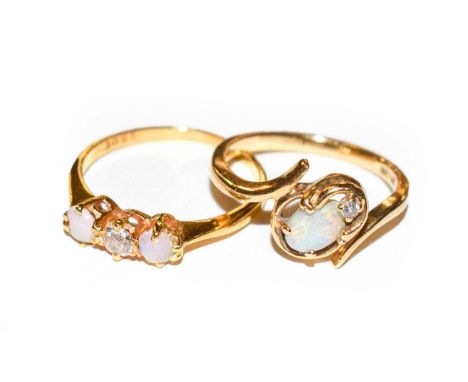 An opal and diamond three stone ring, stamped ‘22CT’, finger size M; and an opal and diamond ring, stamped ‘14K’, finger size