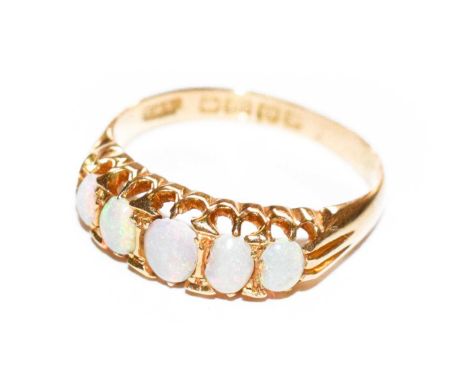 An 18 carat gold opal five stone ring, finger size K1/2