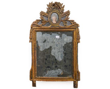 an 18th century Continental giltwood pier glass, with original mercury glass (af), the foliate pediment set with an oval port