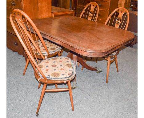 A set of four Ercol elm swan back chairs