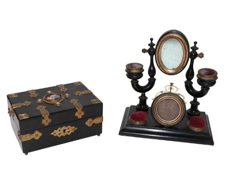 A 19th century ebonised and brass mounted casket, set to the top with a porcelain plaque painted with a portrait; together wi