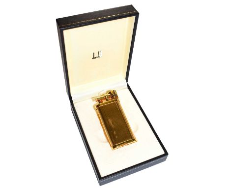 A Dunhill gold plated lighter with engine turned engraving and in fitted box