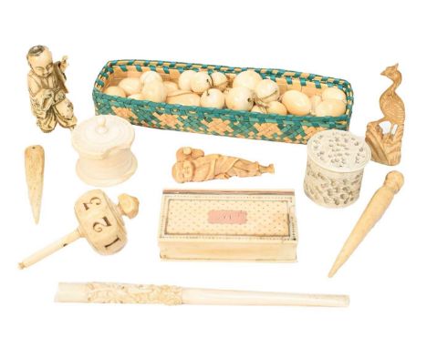 An early 19th-century ivory snuffbox with gold pique inlay, an ivory teetotum gaming piece, a Japanese ivory netsuke of a sch