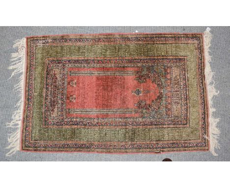 A Kayseri prayer rug, the field with hanging lamp beneath the Mihrab, enclosed by geometric borders, 136cm by 88cm