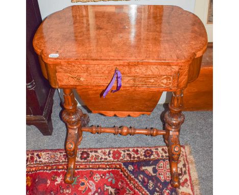 A Victorian burr walnut inlaid and quarter veneered work table, fitted interior with easel backed leather inset writing surfa