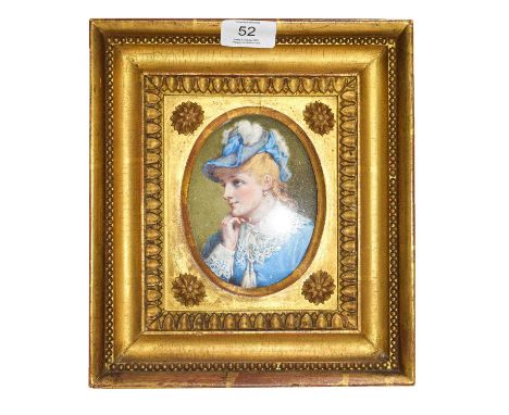 An early 20th century watercolour portrait miniature depicting a lady in blue, and in gilt frame