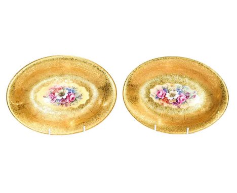 A pair of oval Royal Worcester dishes painted by Freeman with flowers under wide gilt borders (2)Condition report: Good condi
