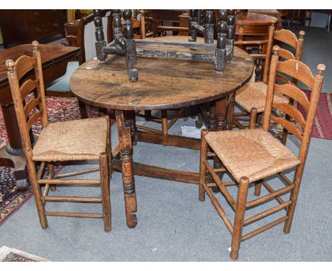 An 18th century oak gateleg dining table, 134cm by 94cm open, by 73cm H; together with a similar smaller example on bobbin tu