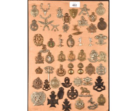 A collection of military and police cap badges including Hertfordshire Constabulary, Palestine Police, Huntingdonshire, Princ