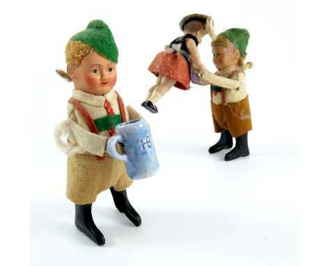 PR. TIN PLATE, POSSIBLY SCHUCO, CLOCKWORK AUTOMATON FIGURES AND ONE OTHER FIGURE AND ONE OTHER PORCELAIN