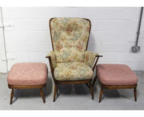 An Ercol, Evergreen 913, high-back winged armchair with two matching extension stools, in Golden Dawn finish (3).