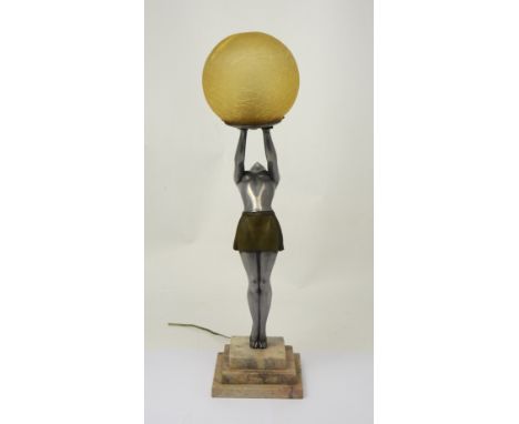 An Art Deco style lamp of a lady holding an amber-coloured globe, on a stepped marble base. CONDITION REPORT Some small chips