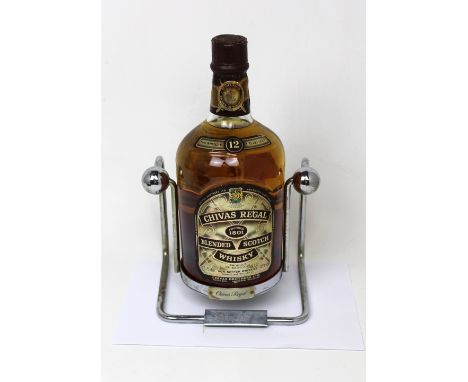 A 1.75l bottle of 'Chivas Regal 12 Year Old Scotch Whisky' in a specially designed decanting cradle.