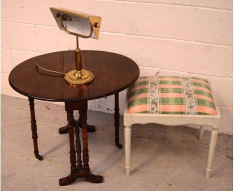 A small late Victorian walnut oval drop-leaf Sutherland table, also a brass desk lamp and a white-painted stool (3).