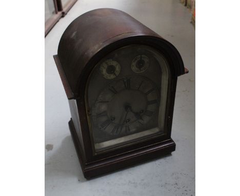 Gustave Becker; a late Victorian mahogany-cased dome-topped Medaille D'Or mantel clock, silvered Roman numeral chapter ring, 