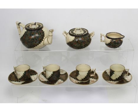 A Doulton Aesthetic Movement eleven-piece tea service, the teapot, sugar bowl and milk jug with Victorian hallmarked silver r