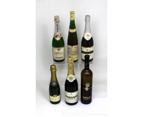 A bottle of 1973 Pomagne Champagne cider, two bottles of Asti Spumante, a bottle of Cavalier Brut Vin Mousseux, a bottle of D