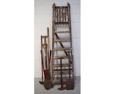 A small quantity of vintage garden tools, a pair of vintage stepladders and an Olivetti typewriter.