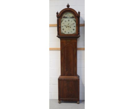 An early 19th century mahogany and brass inlaid Scottish eight-day longcase clock with painted arched enamel dial set with Ro