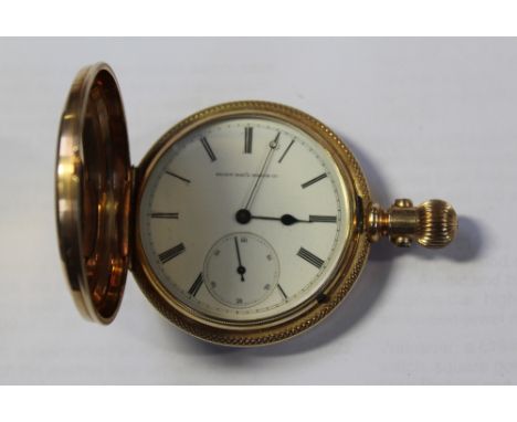 Elgin; a 14ct gold full hunter pocket watch, case engraved with floral, foliate and bird decoration, enamel dial set with Rom