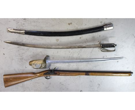 An Eastern sword in scabbard, a replica Naval sword and a replica musket (3).