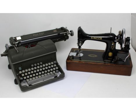 A portable cased Singer sewing machine and a Bluebird standard typewriter (2).