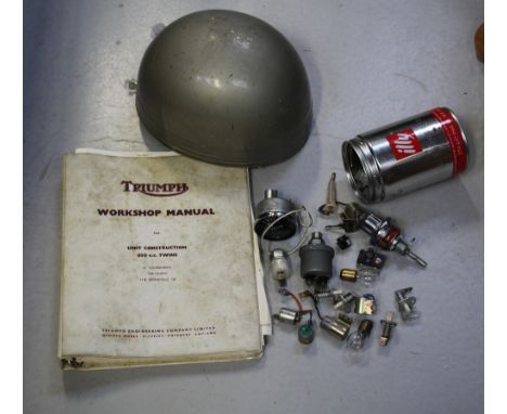 A vintage Everoak motorcycle crash helmet, a Triumph workshop manual for Unit Construction 650cc Twins, also a Smiths voltmet