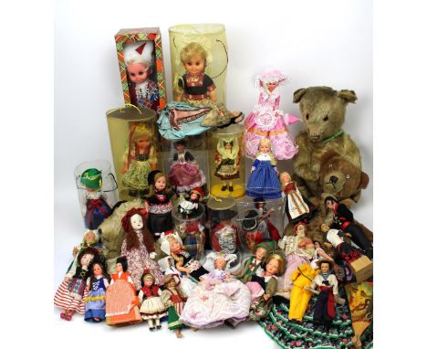 Approximately forty vintage costume dolls, a vintage Chad Valley straw-filled Teddy bear, a smaller bear and a nightdress cas