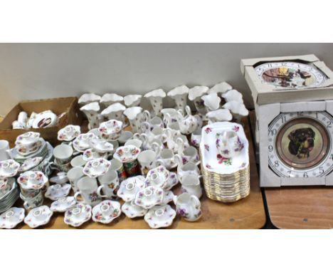 A large quantity of decorative ceramics to include swan-shaped vases, shell-shaped vase, candle holders, mugs, plates, saucer