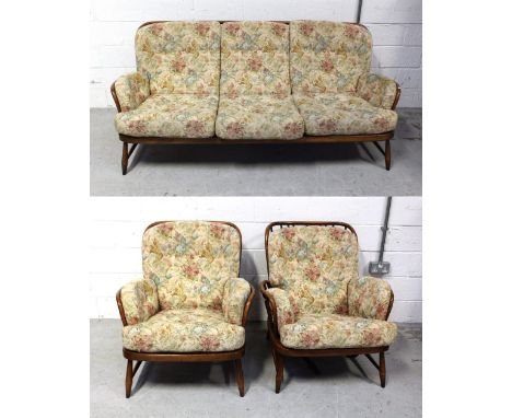 An Ercol three-piece suite, comprising a Windsor Jubilee, 766/3, three-seat sofa, length 186cm and two matching armchairs, in