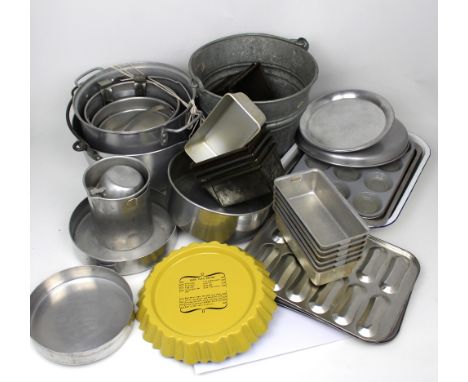 A quantity of vintage kitchenalia to include jam pans, various baking trays and tins and a pair of vintage wooden stepladders